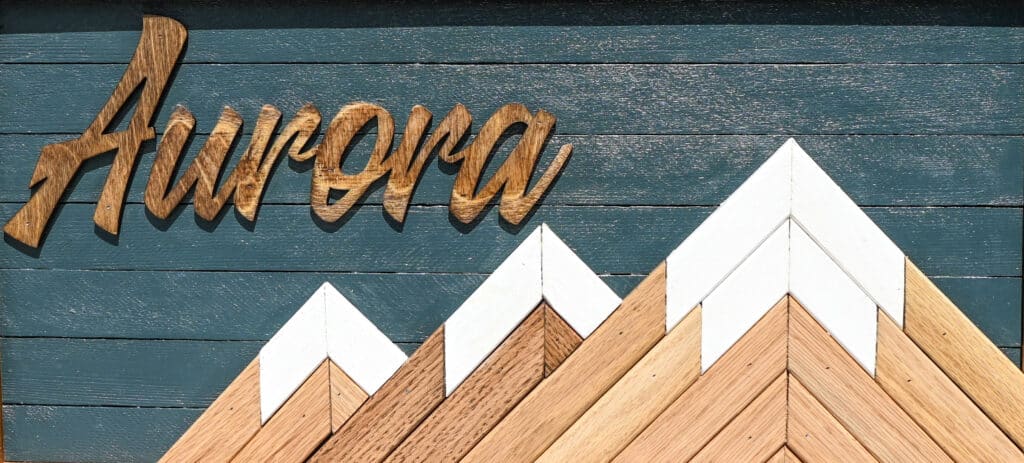 a wood sign on a wall