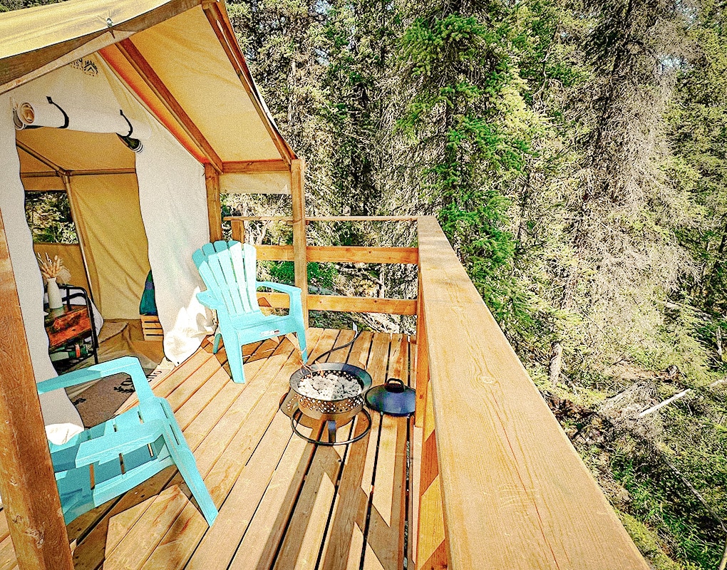 a deck with a chair and a fire pit
