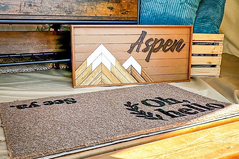 a doormat and a sign