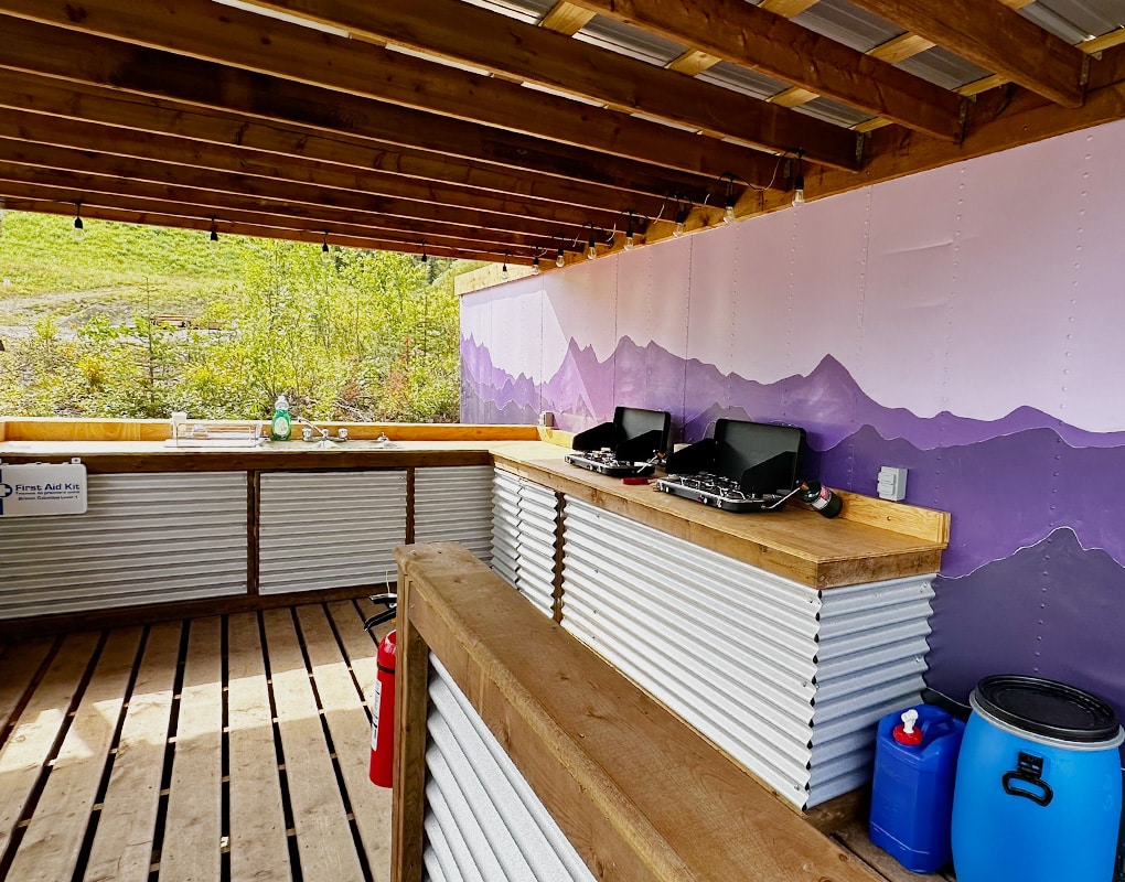 a patio with a table and chairs