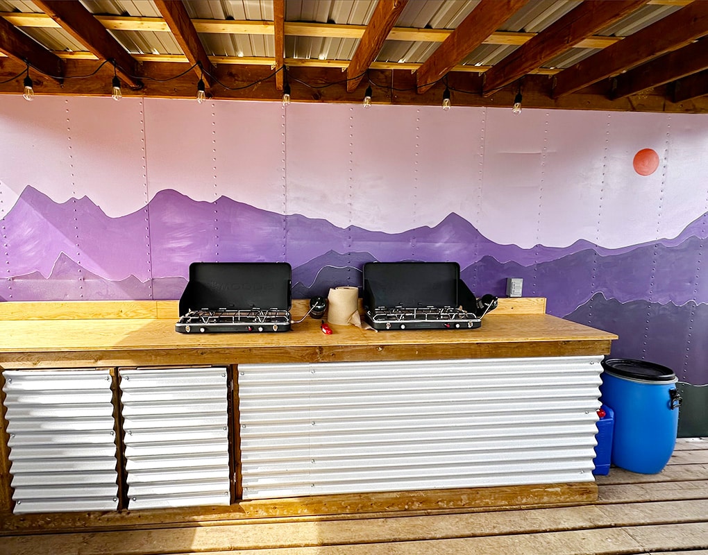 a table with a couple of stoves on it
