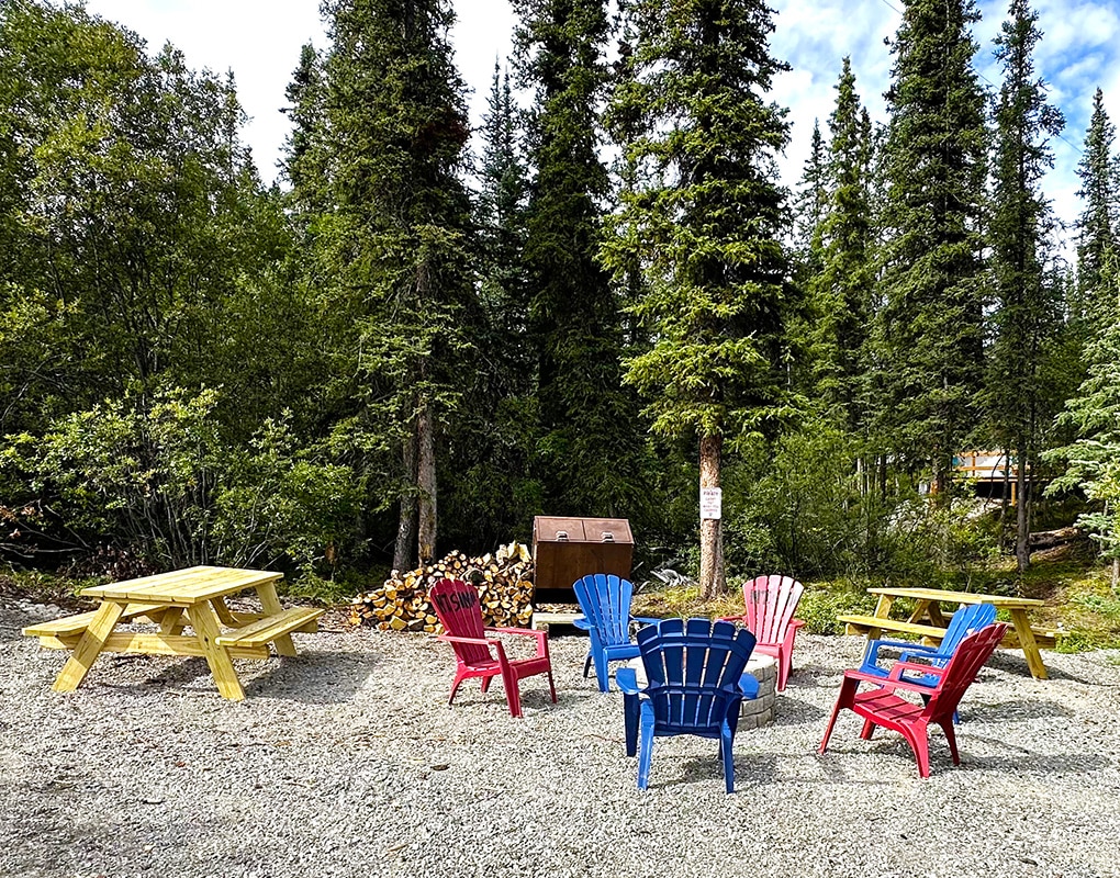 a group of colorful chairs in a gravel area